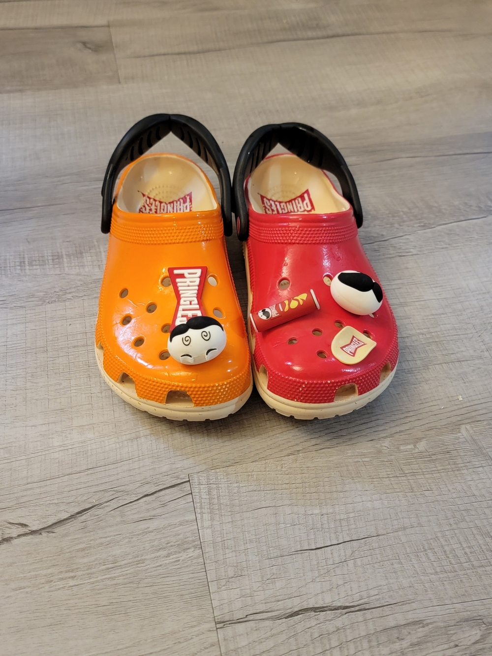 CROCS Kids Two-Tone Orange and Red Clogs with Black Heel Straps